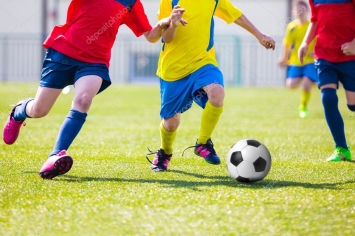 https://st2.depositphotos.com/4318427/11374/i/950/depositphotos_113745954-stock-photo-kids-playing-soccer-football-match.jpg